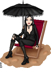 A gothic doll wearing all black sits in a red beach chair under a parasol.